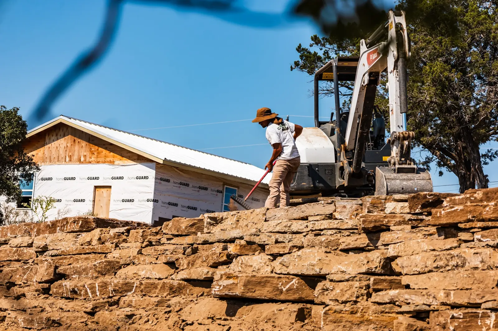 Crew working on stacked limestone
